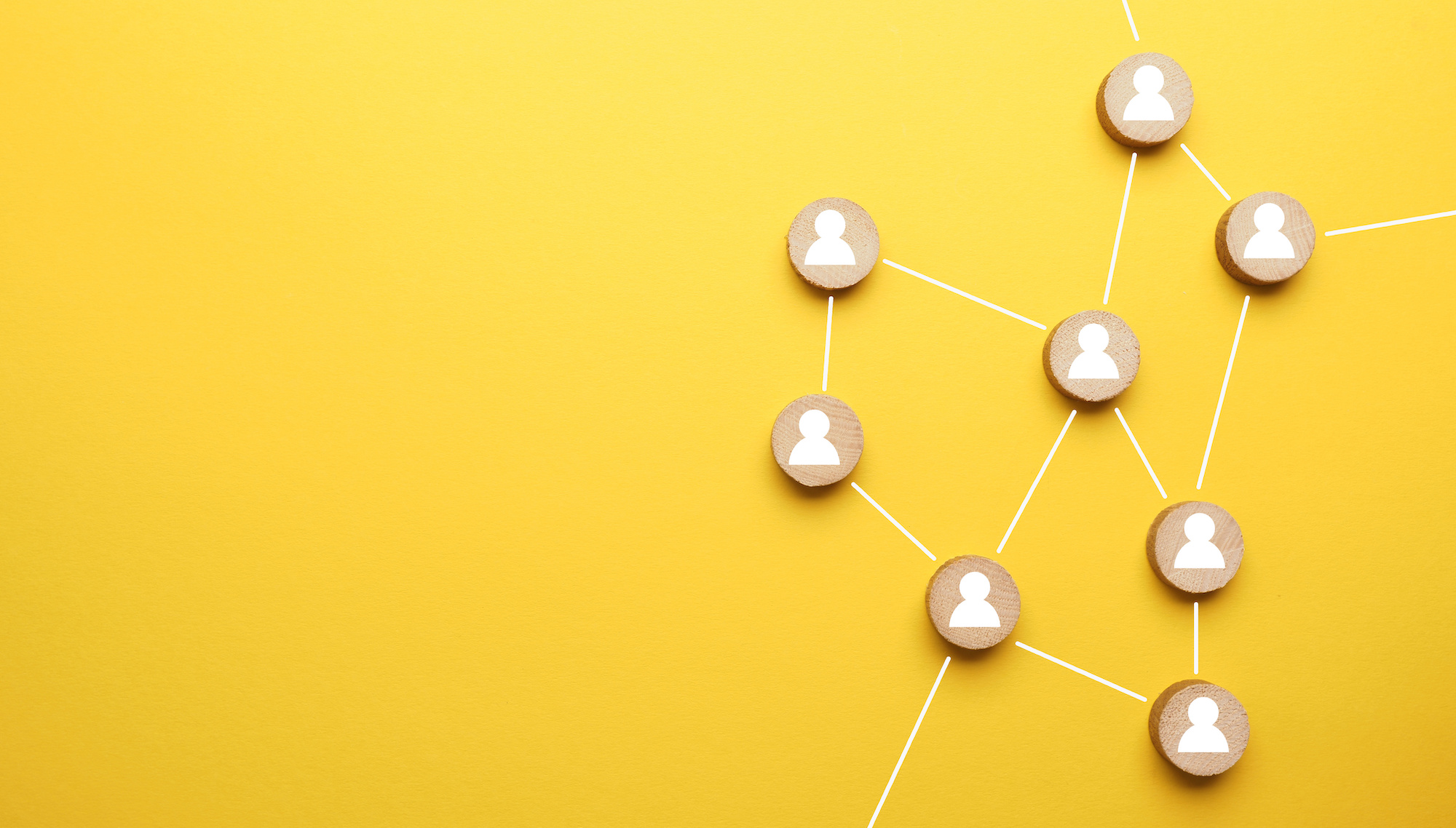 Abstract teamwork, network and community concept on a yellow paper background with space for text